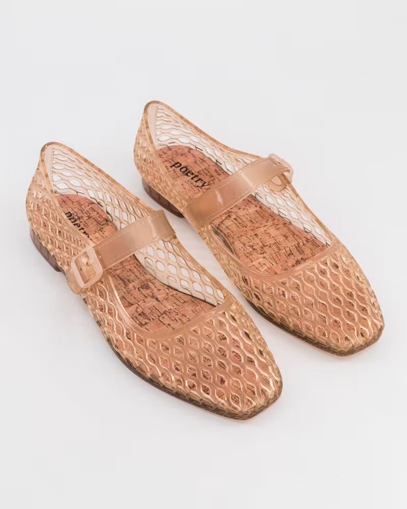 Rose-gold caged jelly mary-jane flat with a buckle strap and cork-effect insole