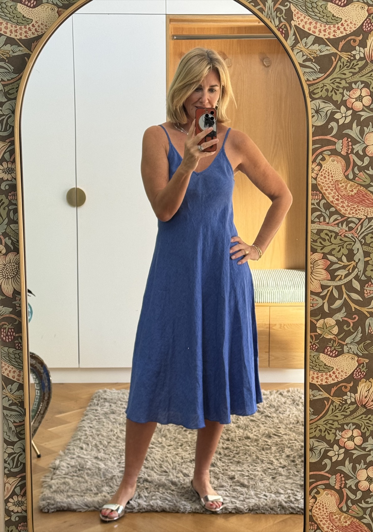 Julie wearing the Thea shift dress, a blue linen slip dress with thin straps